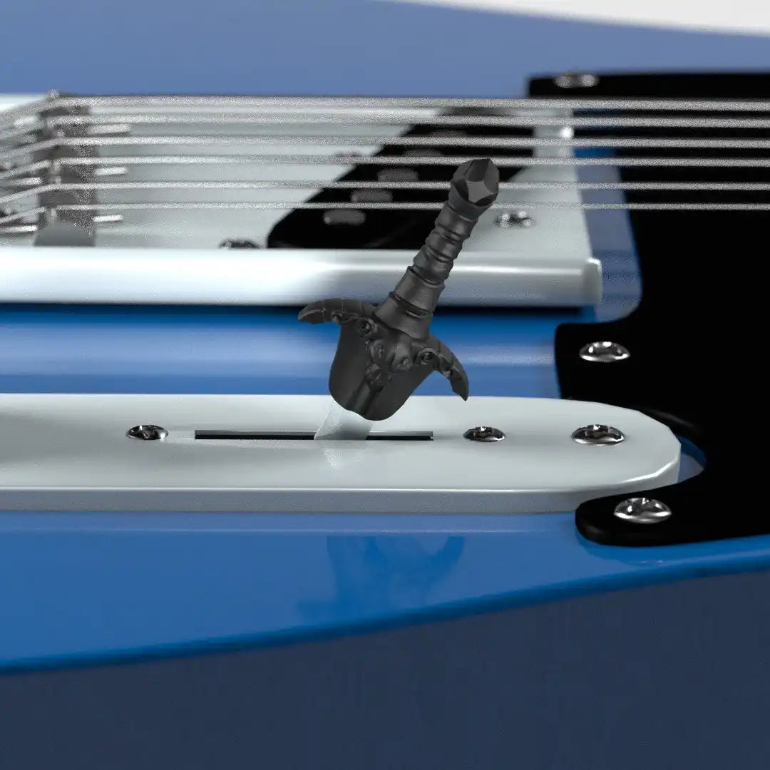 A black toy sword stuck in a guitar.